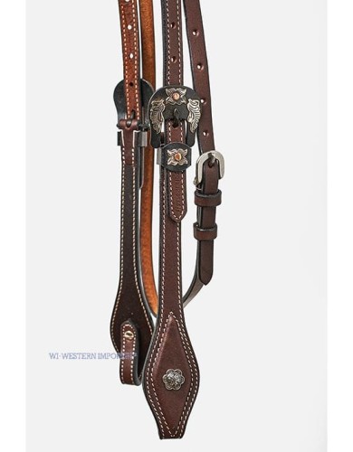 Zbliżenie klamry eagle wings ogłowia Horseman's Tack dark oiled — antyczny metal z miedzianym centrum na ciemnej olejowanej skórze, srebrna concha kwiatowa Spanish-cut — HorsePassion.pl